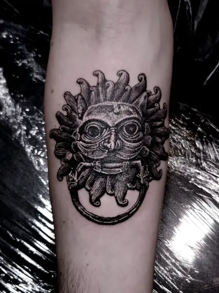 Blackwork sun face tattoo by @bex_hoodless