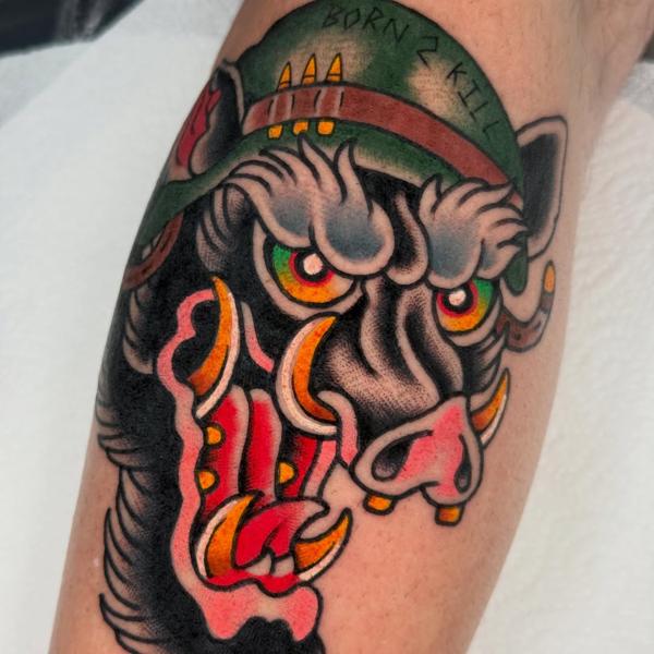 Traditional military boar tattoo by @reece_bolt