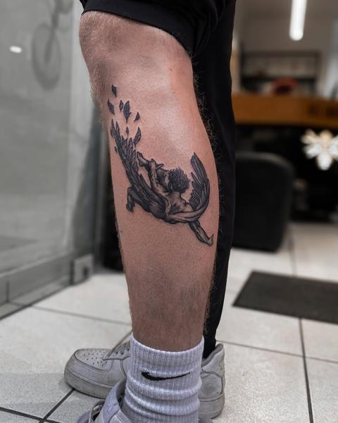 Blackwork winged figure tattoo by @regna.sm_tattooer