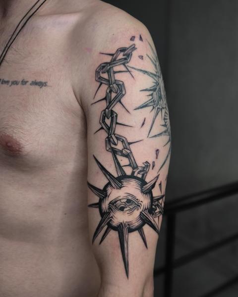 Illustrative spiked eye tattoo by @regna.sm_tattooer