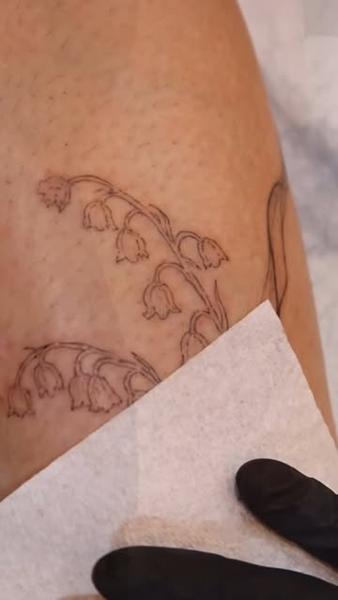 Fine line floral sprig tattoo by @tattooist_rimi