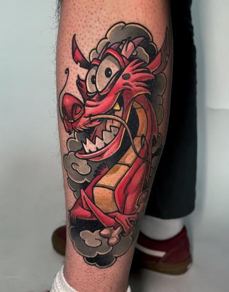 Traditional cartoon dragon tattoo by @rino__tattoo