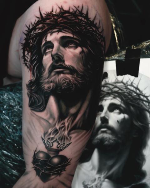 Realism jesus portrait tattoo by @robbieflaviani