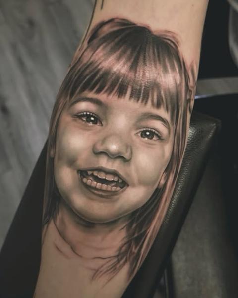 Realism child portrait tattoo by @robbieflaviani