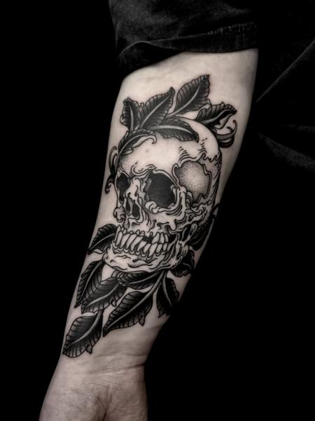 Blackwork skull with leaves tattoo by @robert_w_ashby