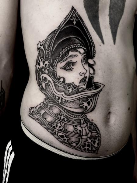 Blackwork woman in armor tattoo by @robert_w_ashby