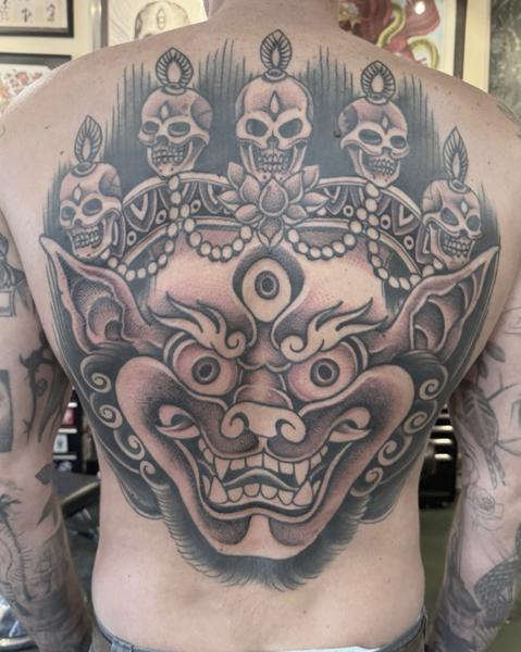 Traditional demon mask tattoo by @robertatkinson_tattoo