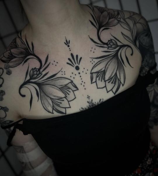 Blackwork floral design tattoo by @robertcresswell28