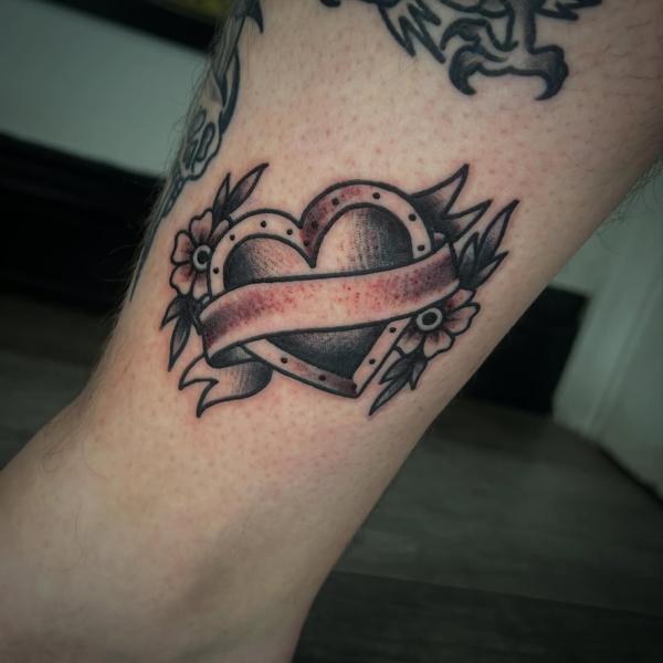 Traditional heart banner tattoo by @robertcresswell28