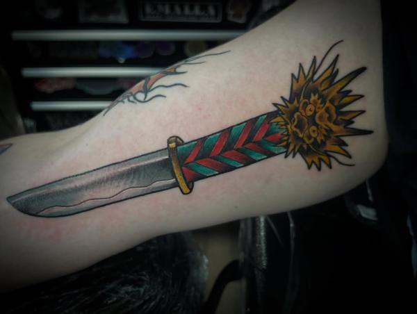 Traditional dagger with lion tattoo by @robertcresswell28