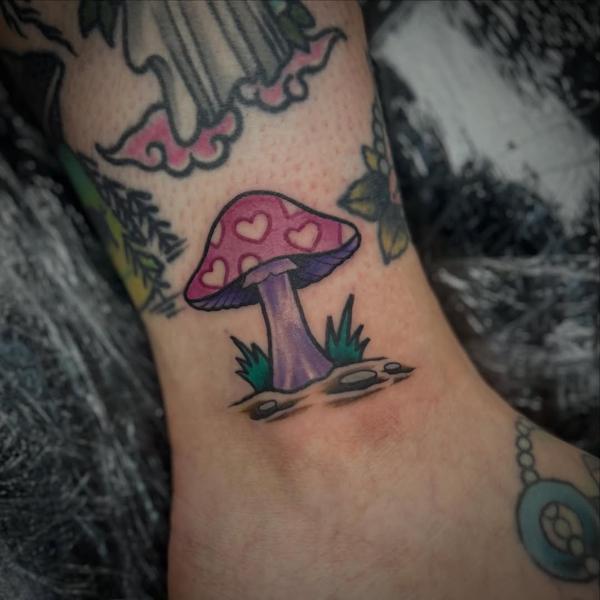 Traditional heart mushroom tattoo by @robertcresswell28