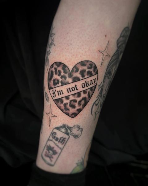 Traditional leopard heart tattoo by @rosiemalonetattoos