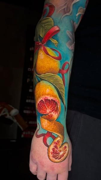 Realism citrus fruit tattoo by @sambarbertattoo