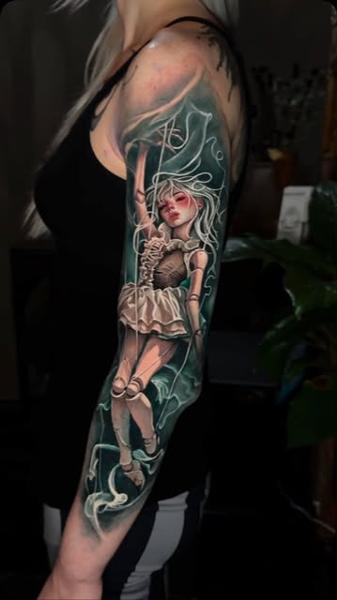 Realism marionette doll tattoo by @sambarbertattoo