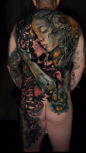 Realism cyborg embracing skull tattoo by @sambarbertattoo
