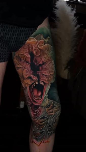 Realism monster face tattoo by @sambarbertattoo