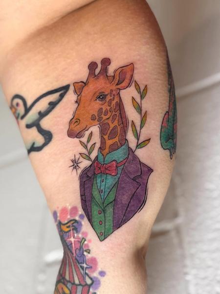 Illustrative giraffe portrait tattoo by @samclaridgetattoos