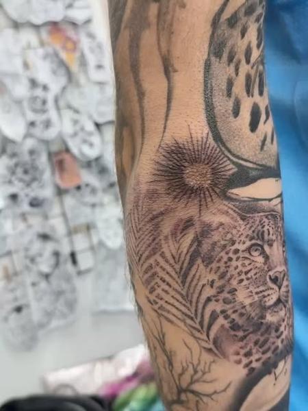 Realism leopard and sun tattoo by @samclaridgetattoos