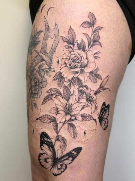 Fine line floral butterfly tattoo by @samclaridgetattoos