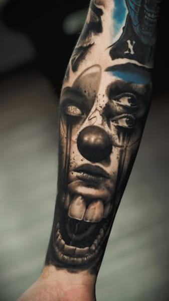 Realism surreal clown tattoo by @samjohns.tattoos