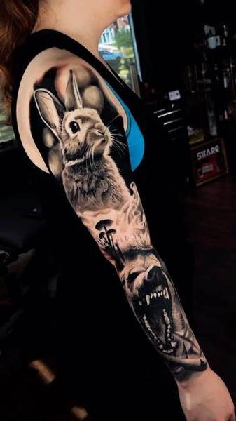 Realism rabbit and wolf tattoo by @samjohns.tattoos