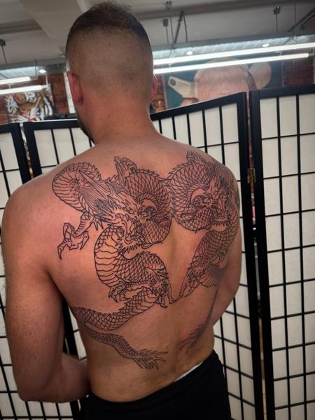 Japanese dragon outline tattoo by @stillwaitingtattoo
