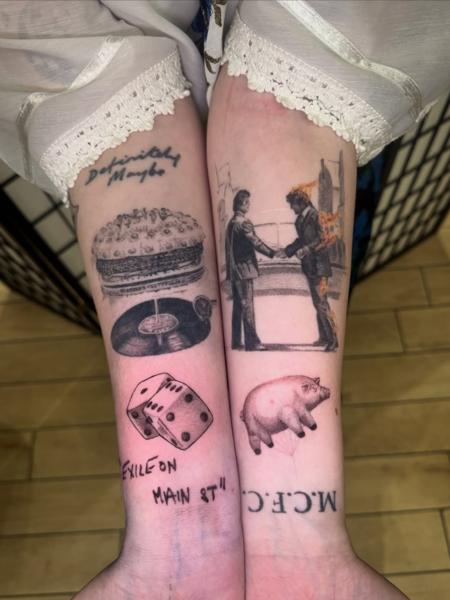 Realism burning man handshake tattoo by @stillwaitingtattoo
