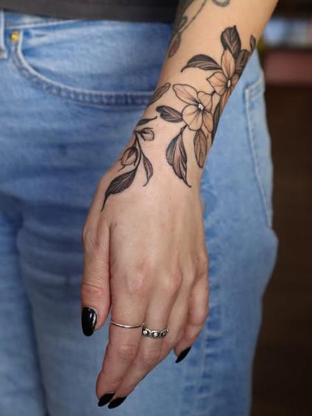Fine line floral design tattoo by @sammylou_tattoo