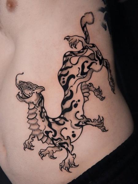 Blackwork oriental beast tattoo by @sasha.tattooist