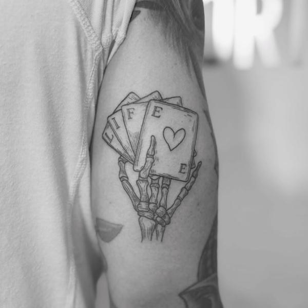 Linework skeleton hand cards tattoo by @sasha7tattoos