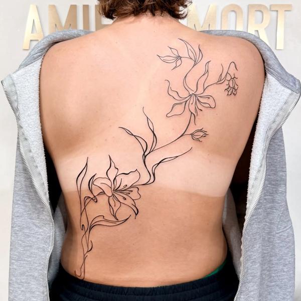 Fine line floral vine tattoo by @sasha7tattoos
