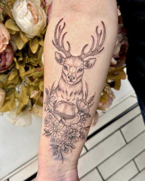 Fine line deer and flowers tattoo by @miss.saskiatattoo