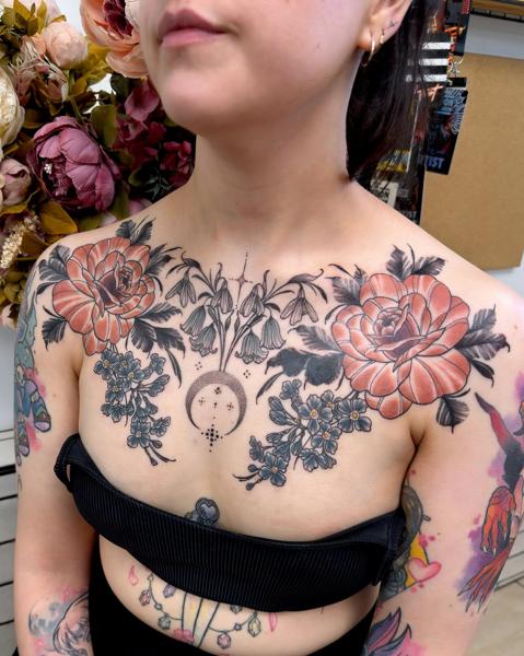 Fine line floral chest piece tattoo by @miss.saskiatattoo