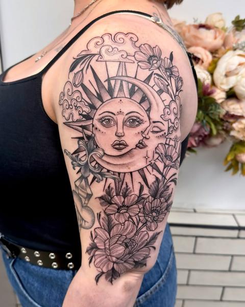 Blackwork sun and moon tattoo by @miss.saskiatattoo