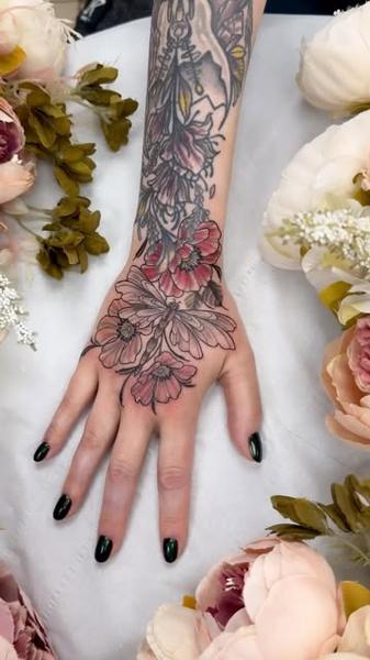 Fine line floral sleeve tattoo by @miss.saskiatattoo