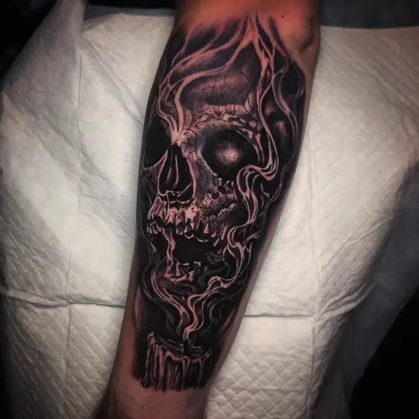 Realism smoky skull tattoo by @rayne.tattoos