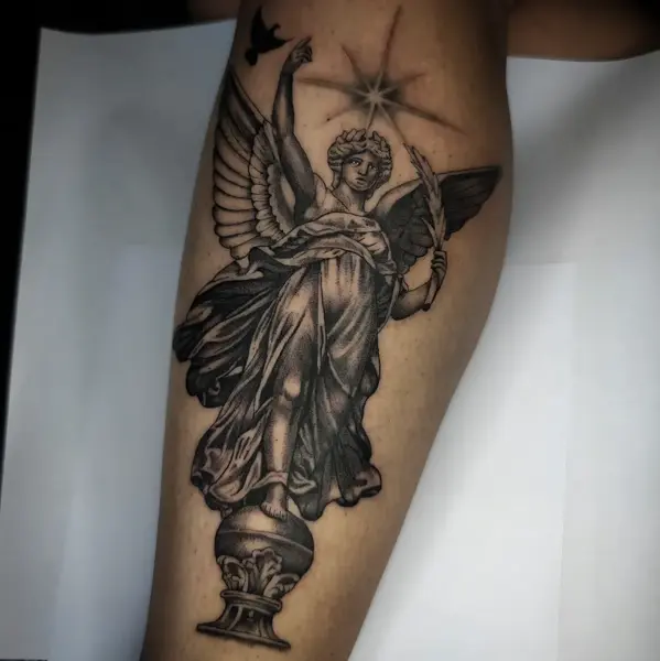 Realism angel statue tattoo by @rayne.tattoos