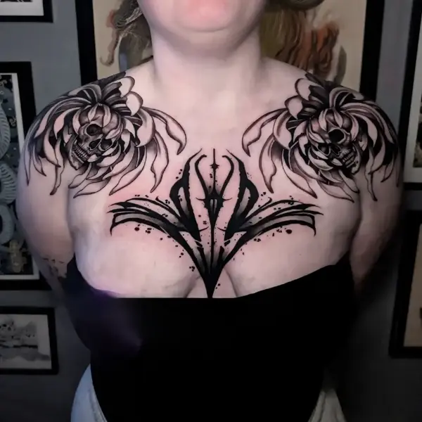 Blackwork floral skulls tattoo by @rayne.tattoos