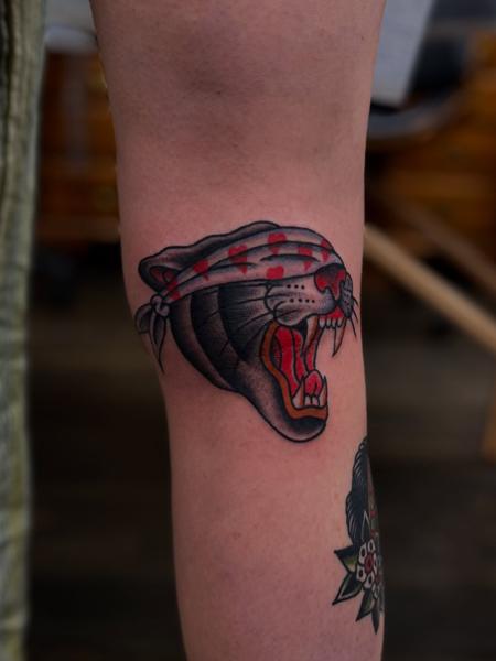 Traditional panther head tattoo by @scott_weatherwax