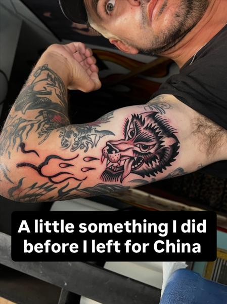 Traditional flaming wolf tattoo by @scott_weatherwax