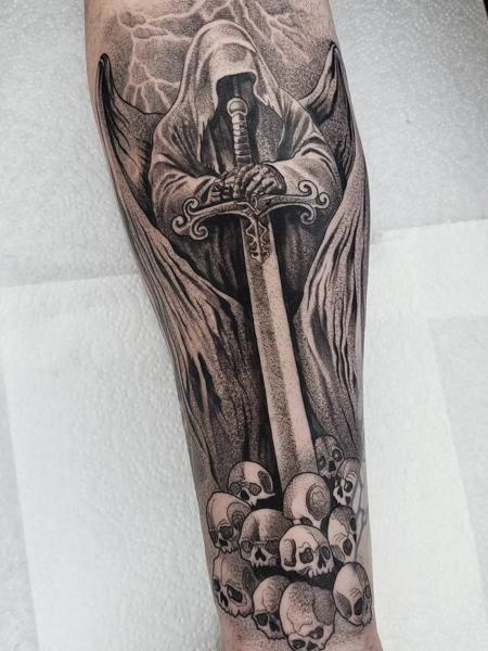 Blackwork grim reaper sword tattoo by @sean.dwyer.tattoo