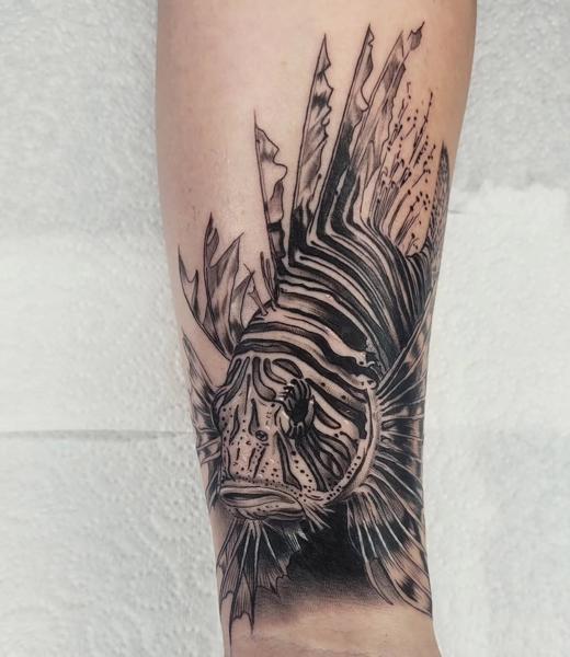 Blackwork lionfish tattoo by @sean.dwyer.tattoo