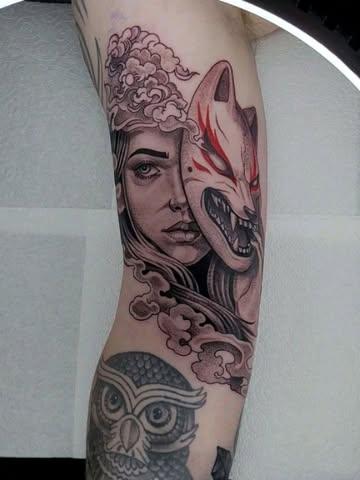 Illustrative woman kitsune mask tattoo by @sean.dwyer.tattoo