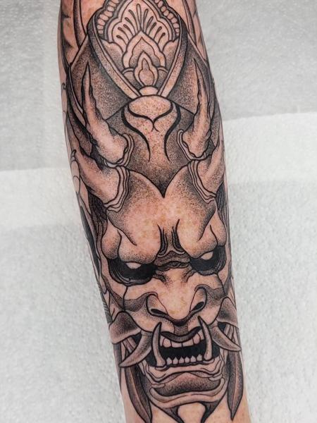 Japanese blackwork oni mask tattoo by @sean.dwyer.tattoo