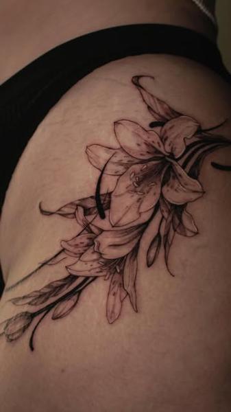 Fine line floral bouquet tattoo by @sem_tattooer