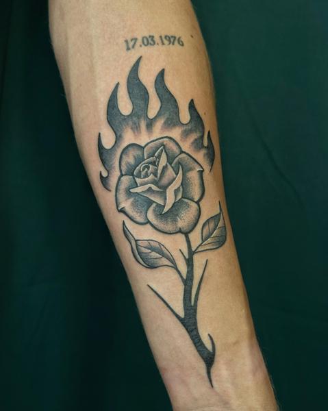 Blackwork flaming rose tattoo by @seshi.ink