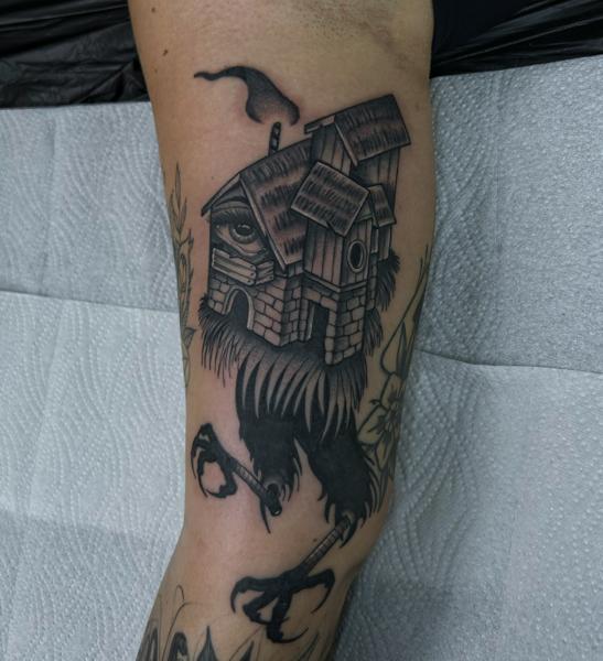 Blackwork house with legs tattoo by @seshi.ink