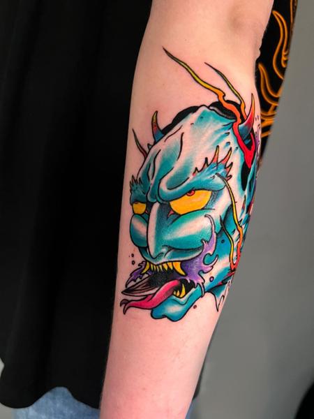 Neo-traditional demon mask tattoo by @the_cutter_tattooer