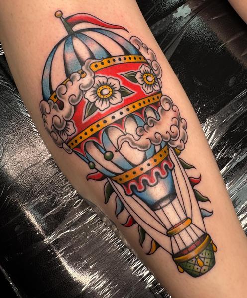 Traditional floral hot air balloon tattoo by @sharitattoos