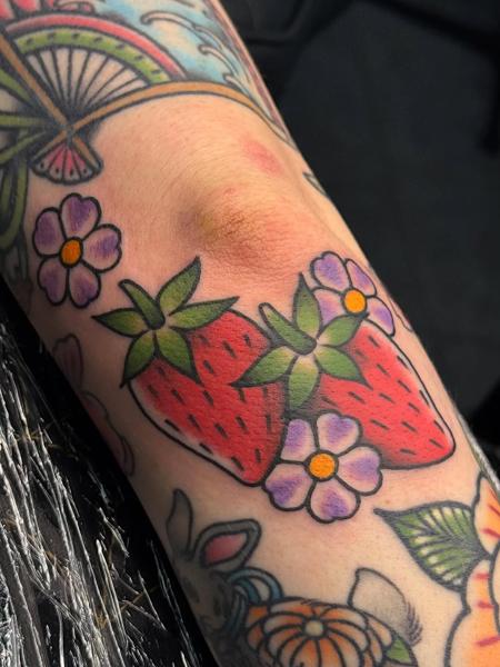 Traditional strawberry flowers tattoo by @sharitattoos
